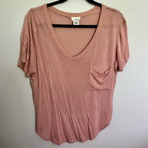 Pink, loose fitting t-shirt.